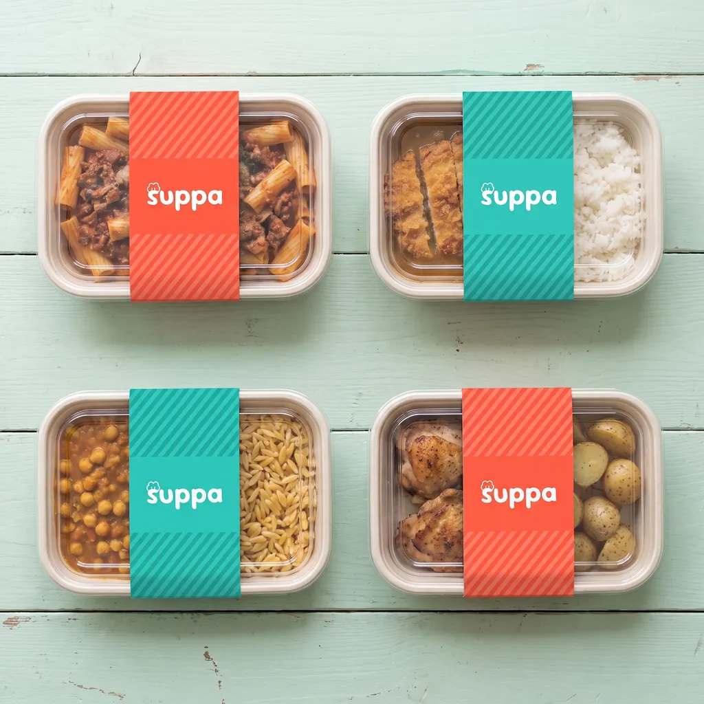 Four Suppa trays in orange and teal striped sleeves, ready to go out